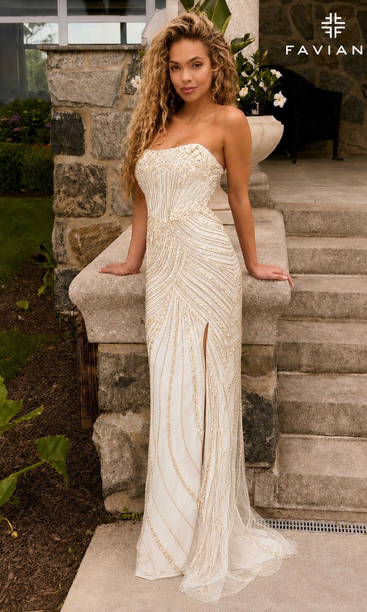 Faviana 11615 ivory, floor-length, strapless corset prom dress featuring a thigh-high slit and gold beaded vertical stripe detailing.